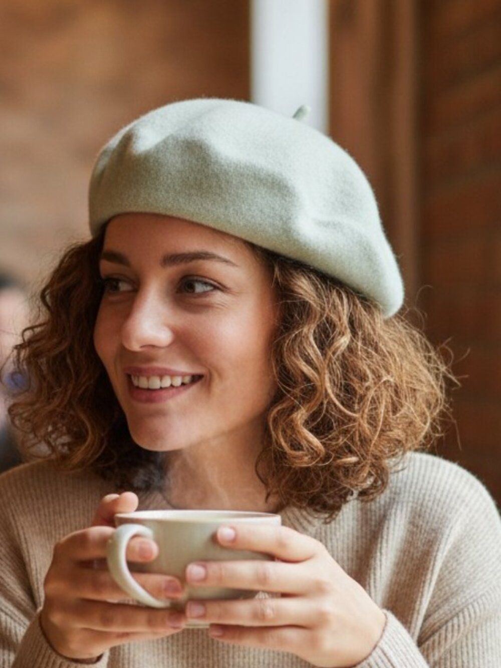 Classic French beret silhouette in soft cream with a subtle mint undertone